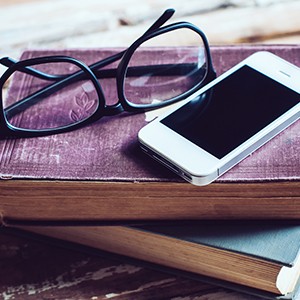 Books, Smartphone And Glasses